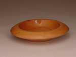 This is a Cherry bowl made by Chip and Vicki Peterson. They own Straight Grain Designs which is a wood working business that goes by the great motto of "Woods beauty, released by design".
They specialize in woodturnings. Send them a note at straightgraindesigns@yahoo.com to see if they can help you with one of their beautiful designs.