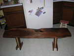 Very nice coffee table made by Zac Van Osdol. He used flame figured Walnut for the top and Walnut and Maple for the legs.