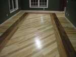 This is an Ash floor laid diagonally with a Walnut and Cherry boarder in the center. This is a great example of how you can mix species in one floor for stunning visual effects.
Walnut and cherry are geat woods to mix with Maple or Ash for the beautifull color contrasts.
